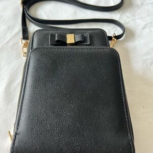 Chic Black Crossbody Bag with Gold Accents